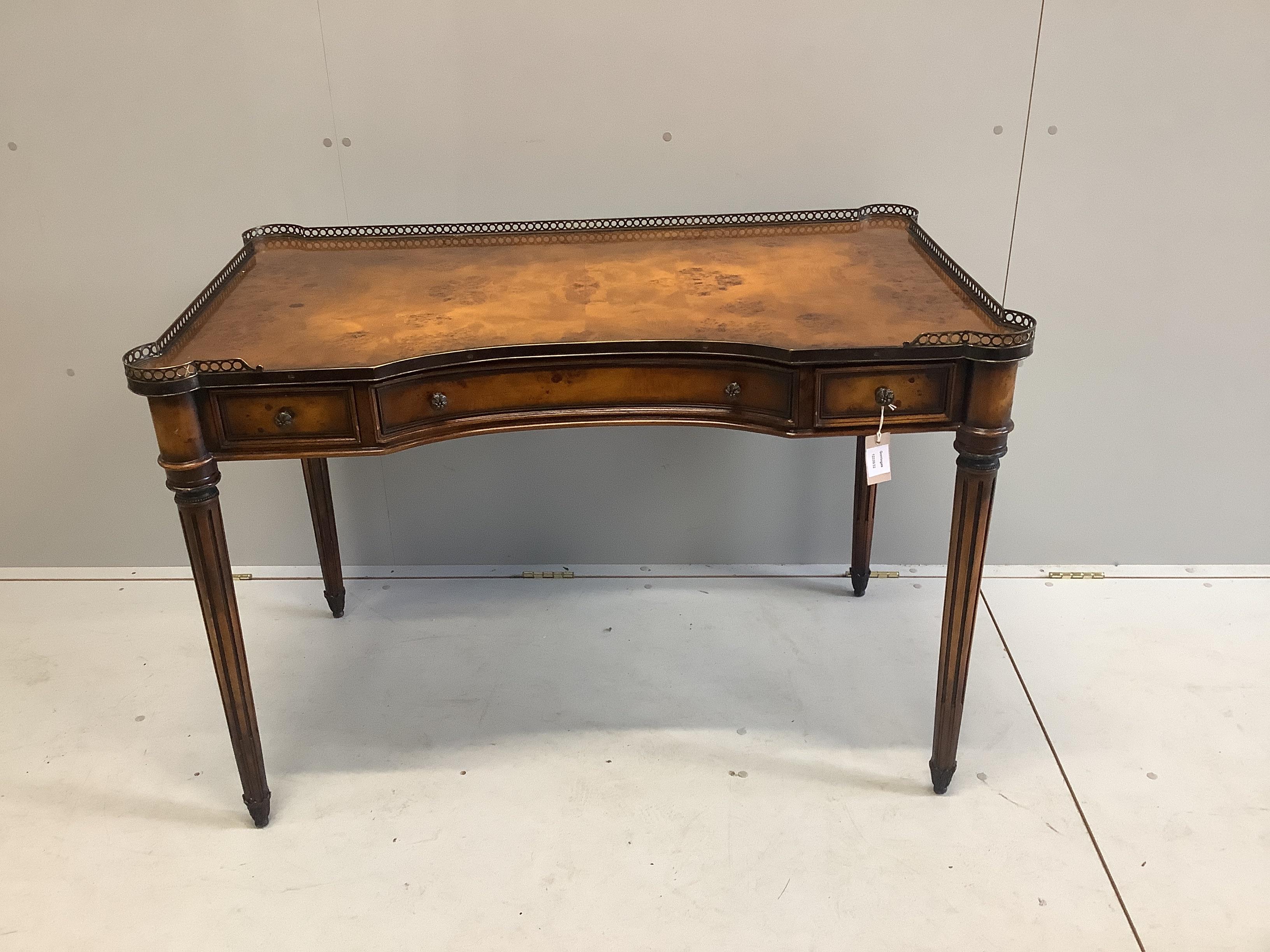 A Theodore Alexander bird's eye maple kneehole writing table, width 114cm, depth 86cm, height 77cm and a caned chair